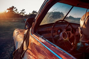 old-rusty-abandoned-car-with-a-respirator-mask-2023-11-27-05-11-34-utc